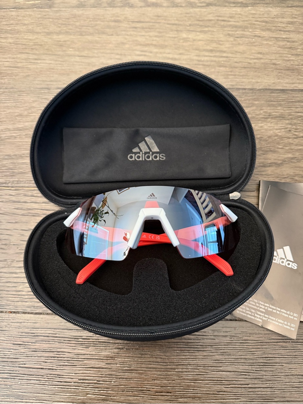 Adidas Sport SP0077 rimless shield sunglasses feature a white/red frames